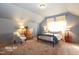 Well lit bedroom features carpeted floor, a window with curtains, and modern lamp lighting at 3009 Gentle Breezes Ln, Raleigh, NC 27614