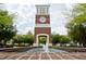 Clock tower with fountain surrounded by lush landscaping offering a gathering place for residents at 3009 Gentle Breezes Ln, Raleigh, NC 27614