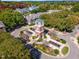 Aerial view of the community clock tower featuring landscaping, water features, and autumn foliage at 3009 Gentle Breezes Ln, Raleigh, NC 27614
