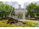Community clubhouse featuring a turtle sculpture, yellow flowers and lush landscaping at 3009 Gentle Breezes Ln, Raleigh, NC 27614