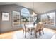 Bright dining room with large windows offering neighborhood views and hardwood flooring at 3009 Gentle Breezes Ln, Raleigh, NC 27614