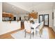 Open floor plan showing the dining room with views to the kitchen, bar, and stairs at 3009 Gentle Breezes Ln, Raleigh, NC 27614