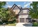 Charming two-story home with a two-car garage, mature trees, and a well-manicured lawn at 3009 Gentle Breezes Ln, Raleigh, NC 27614