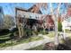 Charming two-story home with landscaped yard, porch, and mature trees at 3009 Gentle Breezes Ln, Raleigh, NC 27614