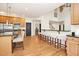 Open kitchen featuring a breakfast bar with seating and stainless steel appliances at 3009 Gentle Breezes Ln, Raleigh, NC 27614