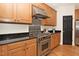 Kitchen showcasing stainless steel appliances and hardwood floors at 3009 Gentle Breezes Ln, Raleigh, NC 27614