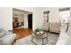 Bright living room features neutral furniture, decorative rug and access to the dining room at 3009 Gentle Breezes Ln, Raleigh, NC 27614