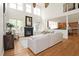 Bright living room with a fireplace, large windows, and open access to the kitchen at 3009 Gentle Breezes Ln, Raleigh, NC 27614