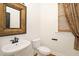 Powder room features a unique sink and bronze hardware at 3009 Gentle Breezes Ln, Raleigh, NC 27614