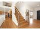 Wooden staircase with wrought iron spindles connects the home's multiple floors at 3009 Gentle Breezes Ln, Raleigh, NC 27614