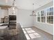 Bright kitchen with stainless steel appliances, granite countertops, and modern lighting at 49 Abingdon Farms Dr, Selma, NC 27576