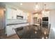 Modern kitchen with white cabinets, granite countertops, and stainless steel appliances at 49 Abingdon Farms Dr, Selma, NC 27576