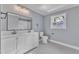 Modern bathroom with double vanity and patterned tile floors at 505 S Magnolia Ave, Dunn, NC 28334