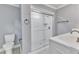 Clean bathroom with a large walk-in shower and patterned floors at 505 S Magnolia Ave, Dunn, NC 28334