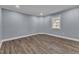 Simple bedroom with wood floors and neutral wall color at 505 S Magnolia Ave, Dunn, NC 28334