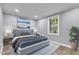 Bright bedroom with a comfortable bed and large window at 505 S Magnolia Ave, Dunn, NC 28334