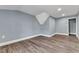 Upstairs bedroom with wood-look floors and closet at 505 S Magnolia Ave, Dunn, NC 28334