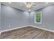 Simple bedroom with wood floors and neutral wall color at 505 S Magnolia Ave, Dunn, NC 28334