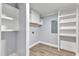 Laundry room with built-in shelving and washer/dryer hookups at 505 S Magnolia Ave, Dunn, NC 28334