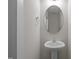 Small bathroom with pedestal sink and oval mirror at 804 Pryor St # 49, Mebane, NC 27302