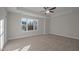 Bright and airy bedroom with plush carpeting and a large window at 804 Pryor St # 49, Mebane, NC 27302