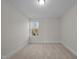 Bright bedroom with carpet flooring and window at 804 Pryor St # 49, Mebane, NC 27302