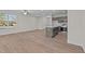 Open concept dining room with hardwood floors, kitchen island, and patio access at 804 Pryor St # 49, Mebane, NC 27302
