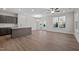 Open concept dining room with hardwood floors, kitchen island, and patio access at 804 Pryor St # 49, Mebane, NC 27302