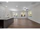 Open concept dining room with hardwood floors, kitchen island, and patio access at 804 Pryor St # 49, Mebane, NC 27302