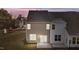 Two-story townhome with backyard patio and neutral siding at 804 Pryor St # 49, Mebane, NC 27302