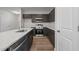 Modern kitchen featuring dark cabinetry, stainless steel appliances, and granite countertops at 804 Pryor St # 49, Mebane, NC 27302
