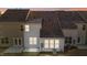 Rear view of townhouses with patios and sunrooms at dusk at 806 Pryor St # 50, Mebane, NC 27302