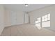 Spacious bedroom with carpeted floors and two doors at 806 Pryor St # 50, Mebane, NC 27302