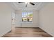 Spacious bedroom with large window and wood-look floors at 806 Pryor St # 50, Mebane, NC 27302