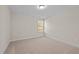 Bright bedroom with a window and carpet at 806 Pryor St # 50, Mebane, NC 27302