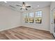 Bright bedroom with hardwood floors and a ceiling fan at 806 Pryor St # 50, Mebane, NC 27302