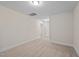 Simple hallway with carpet and neutral walls at 806 Pryor St # 50, Mebane, NC 27302