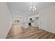 Modern kitchen with white cabinets, granite countertops, and an island at 806 Pryor St # 50, Mebane, NC 27302