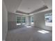 Large bedroom features tray ceiling and multiple windows providing ample natural light at 236 Alden Way, Angier, NC 27501