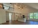 Open-concept kitchen featuring an island, modern white cabinetry, and stainless steel appliances at 236 Alden Way, Angier, NC 27501