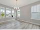 Bright living room featuring ample natural light, hardwood floors, neutral walls, and views of the neighborhood, ready for decor at 236 Alden Way, Angier, NC 27501
