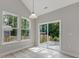 Bright eat-in area featuring a sliding door and two windows, great for entertaining and relaxation at 236 Alden Way, Angier, NC 27501