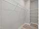 Spacious walk-in closet with wire shelving, neutral walls, and modern flooring at 236 Alden Way, Angier, NC 27501