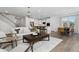 Open-concept living space that connects the living room, dining area, and kitchen at 291 Alden Way, Angier, NC 27501