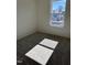 Cozy bedroom featuring soft carpeting and a window offering a view of nearby houses at 1050 Mountain Crown St, Durham, NC 27703