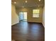 Inviting living room with hardwood floors, sliding glass doors, large windows, neutral paint and plenty of light at 1050 Mountain Crown St, Durham, NC 27703