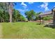 Large and well-maintained backyard with lush green grass and a wooded perimeter, ready for outdoor activities at 6965 Us-401, Fuquay Varina, NC 27526