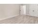 This bedroom features neutral walls, plush carpeting, and access to a closet and en-suite bath at 6965 Us-401, Fuquay Varina, NC 27526