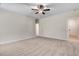 Neutral bedroom with plush carpeting, natural light, and a view to the doorway at 6965 Us-401, Fuquay Varina, NC 27526