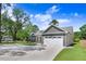 The home features a two car garage and gray siding at 6965 Us-401, Fuquay Varina, NC 27526